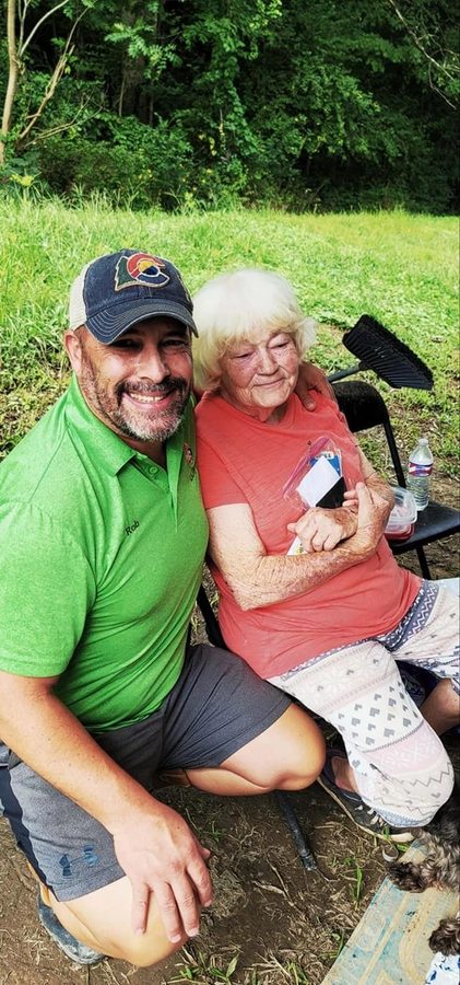 Rob with community member during disaster relief