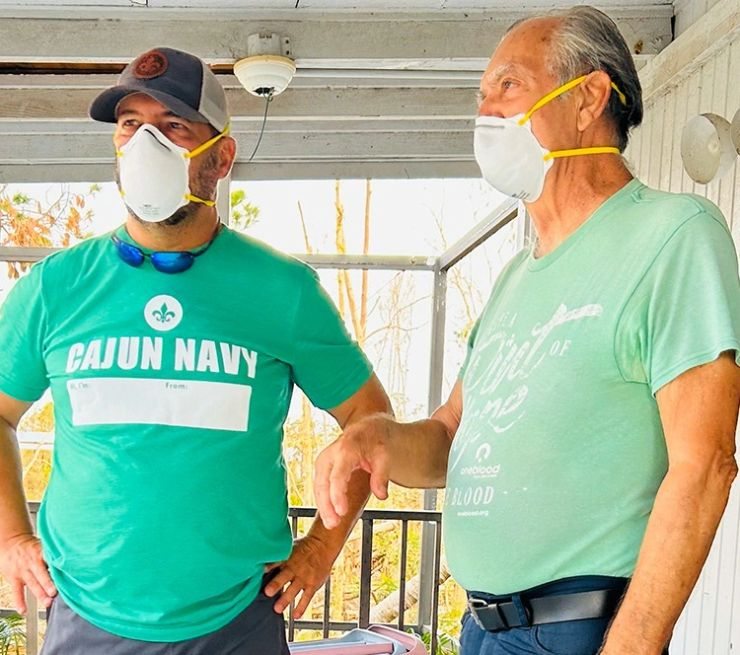 Rob speaking with resident during relief